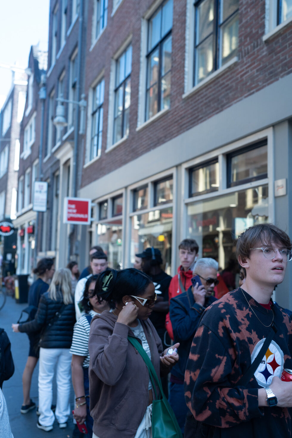 People line up outside a store in Amsterdam, Netherlands.