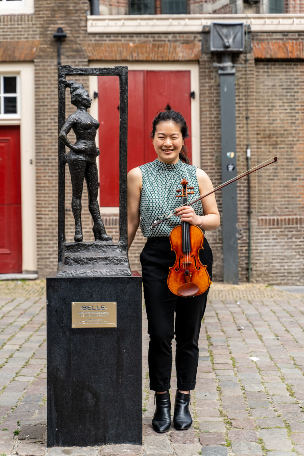 Violinist posing with 